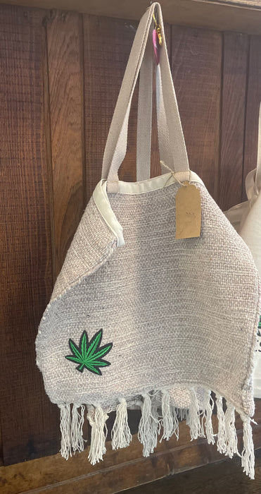 Soleil Bris PotLeaf applique bag in cream with tassels